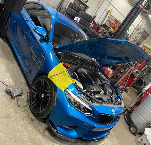 Blue BMW M2 Competition Engine Service