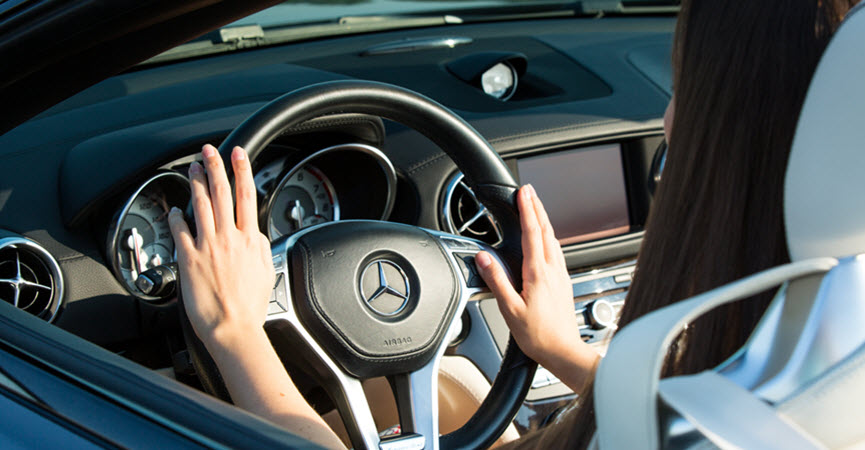 Female Driving Mercedes-Benz Car